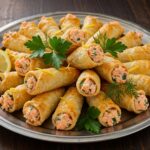 Finished cornets feuilletés saumon displayed as amuses bouches, perfect for any elegant gathering.
