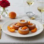 Finished financier fleur d'oranger and apricot dessert, beautifully presented for serving.