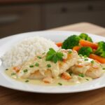 Delicious Poulet Crémeux au Boursin served with rice, a savory dish perfect for dinner.