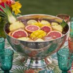 Completed Punch Tropical with colorful fruits in a bowl, perfect for summer parties.