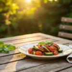 Plate of ratatouille provençale garnished with basil, perfect for summer dining.