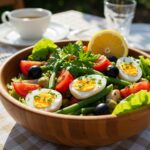 Beautifully presented salade niçoise, showcasing the freshness of Mediterranean cuisine, perfect for summer meals.