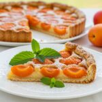 Delicious slice of tarte aux abricots served as a delightful summer dessert.