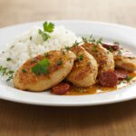 Plated poulet au chorizo showcasing its rich flavors and vibrant presentation, perfect for dinner.