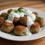 Finished boulettes de dinde grecques with tzatziki, perfect for a Greek-inspired meal.