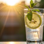 Refreshing glass of eaux infusées ready to enjoy, highlighting the vibrant flavors of infused fruits and herbs.