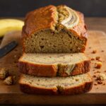 Finished gâteau à la banane sans sucre on a cutting board, ideal for a healthy dessert option.