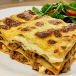 Finished lasagne de courgettes, champignons et jambon ready to serve.