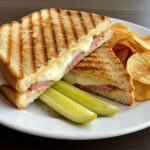 Finished sandwich mixte, a beautifully golden sandwich grillé with ham and cheese, ideal for lunch.