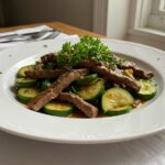 Finished sauté de courgettes et bœuf served with colorful vegetables, perfect for a quick dinner.