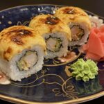 Delicious sushi au four with salmon, served elegantly for a Japanese dining experience.