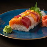 Finished sushi mosaïque beautifully presented on a plate, ideal for sushi lovers.
